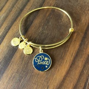 Alex and Ani gold peace charm bracelet